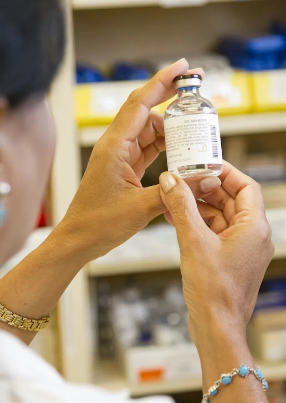 a person holding a bottle
